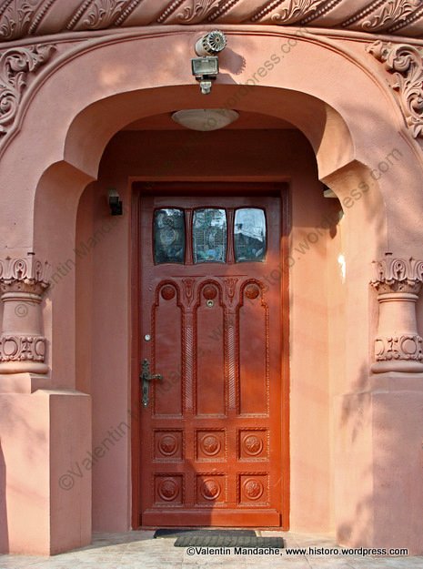 Art Nouveau echoes in a late 1920s Neo-Romanian style doorway, Bucharest