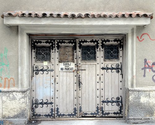 Garage doorway of a "fairy castle" style architecture house