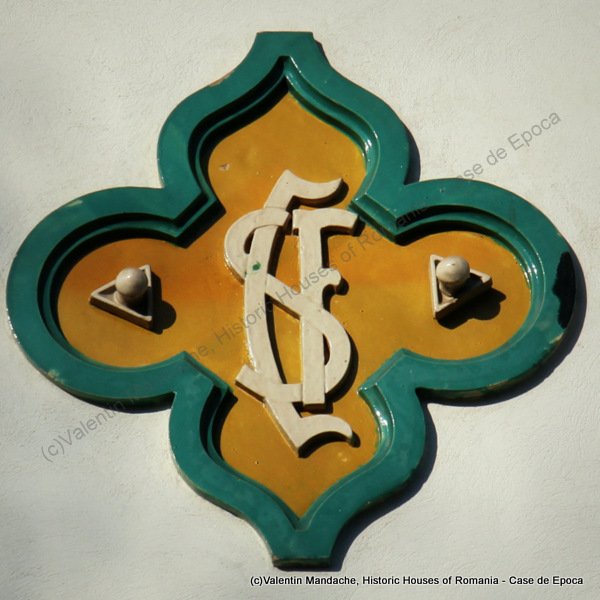 The Central School for Girl's logo, displayed on the street facade of this renowned Bucharest high school (the abreviations stands for Scoala Centrala de Fete), 